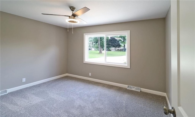 901 School Rd, Peculiar, MO 64078 - carpeted spare room featuring ceiling fan and baseboards
