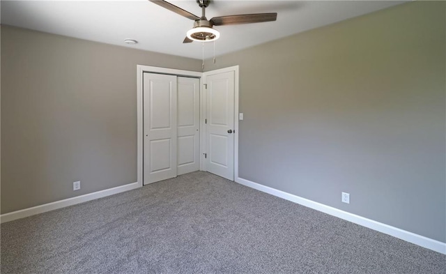 901 School Rd, Peculiar, MO 64078 - unfurnished bedroom with carpet flooring, a closet, and ceiling fan