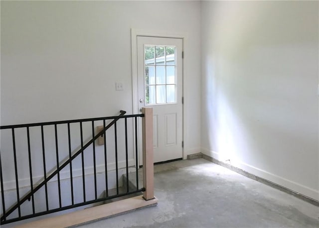 901 School Rd, Peculiar, MO 64078 - entryway with unfinished concrete floors and baseboards