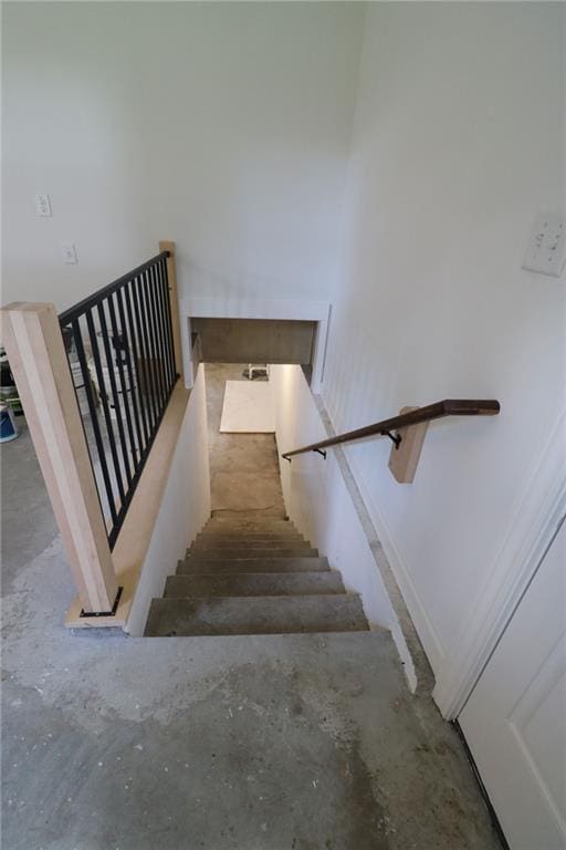 901 School Rd, Peculiar, MO 64078 - staircase with unfinished concrete flooring