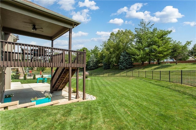 22908 E 41st Ter S, Blue Springs, MO 64015 - fenced backyard featuring a patio, stairs, ceiling fan, and a wooden deck