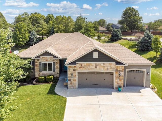 22908 E 41st Ter S, Blue Springs, MO 64015 - craftsman house with driveway, a front yard, an attached garage, and stone siding