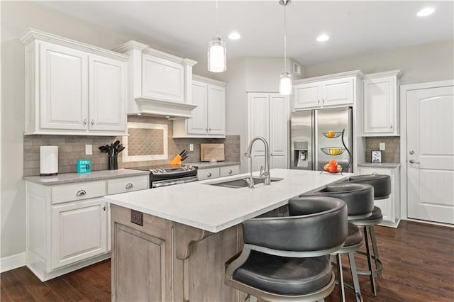 22908 E 41st Ter S, Blue Springs, MO 64015 - kitchen featuring stainless steel appliances, dark wood finished floors, white cabinetry, and recessed lighting