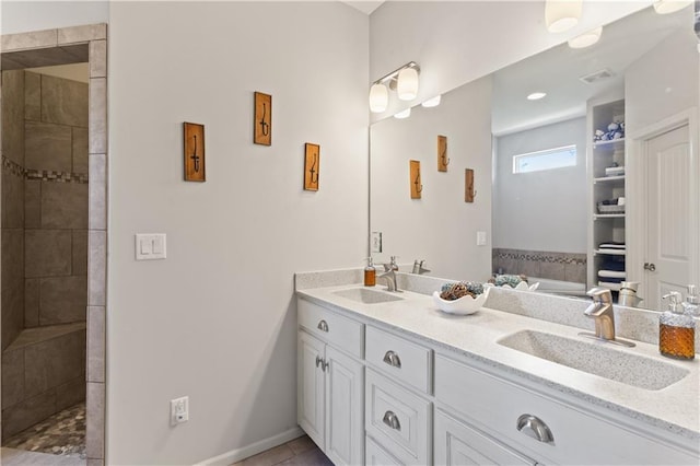 22908 E 41st Ter S, Blue Springs, MO 64015 - bathroom featuring double vanity, a tile shower, a tub, and tile patterned floors