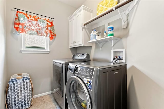 22908 E 41st Ter S, Blue Springs, MO 64015 - washroom with washing machine and clothes dryer, cabinet space, plenty of natural light, and light tile patterned flooring