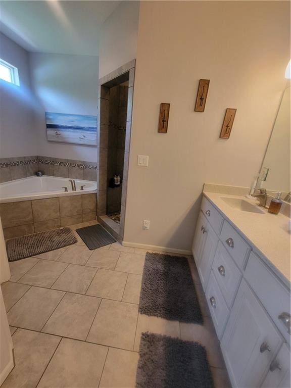 22908 E 41st Ter S, Blue Springs, MO 64015 - bathroom featuring vanity, a bath, a shower stall, and tile patterned floors