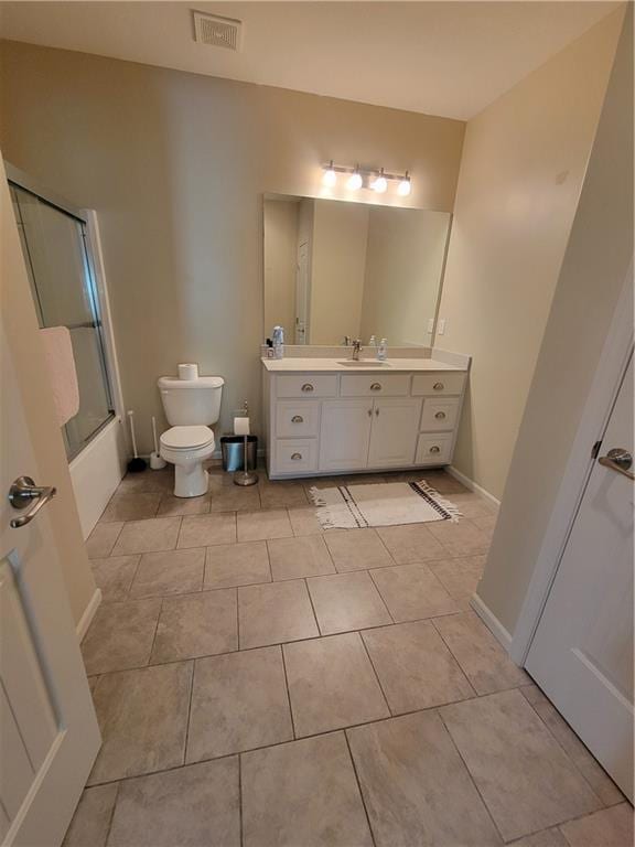 22908 E 41st Ter S, Blue Springs, MO 64015 - full bathroom with vanity, tile patterned floors, and shower / bath combination with glass door