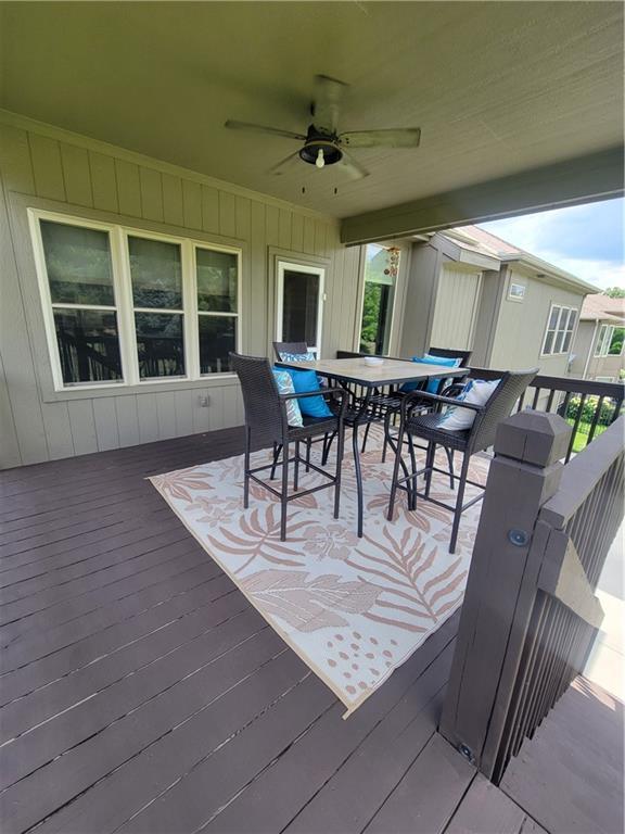 22908 E 41st Ter S, Blue Springs, MO 64015 - wooden deck with a ceiling fan and outdoor dining space