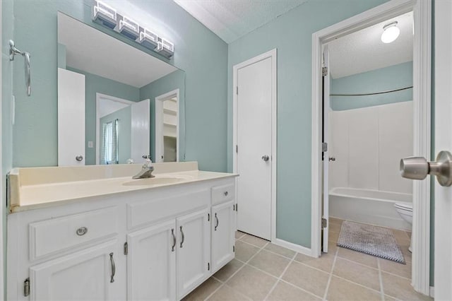518 NE 6th St Unit A, Blue Springs, MO 64014 - bathroom with vanity, a textured ceiling, tile patterned floors, and shower / bath combination