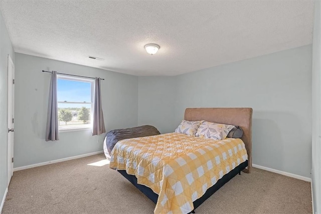518 NE 6th St Unit A, Blue Springs, MO 64014 - carpeted bedroom featuring a textured ceiling and baseboards