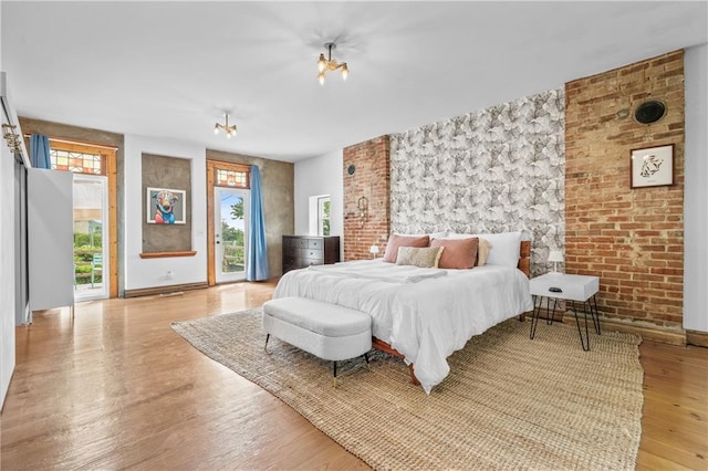 1637 Jefferson St, Kansas City, MO 64108 - bedroom featuring access to outside and light wood-style flooring