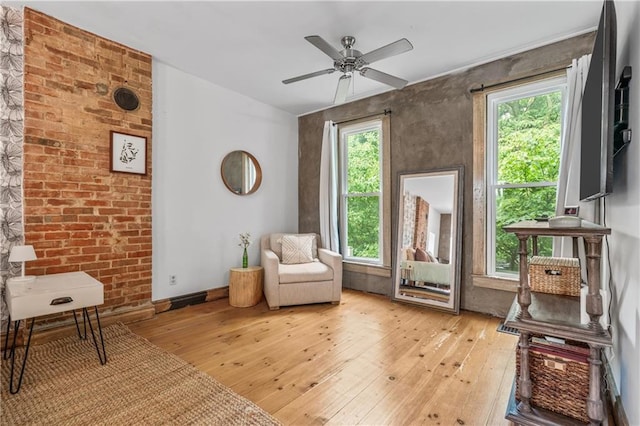 1637 Jefferson St, Kansas City, MO 64108 - living area with light wood-style flooring and a ceiling fan