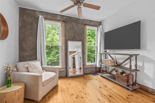 1637 Jefferson St, Kansas City, MO 64108 - sitting room with plenty of natural light, hardwood / wood-style floors, and a ceiling fan