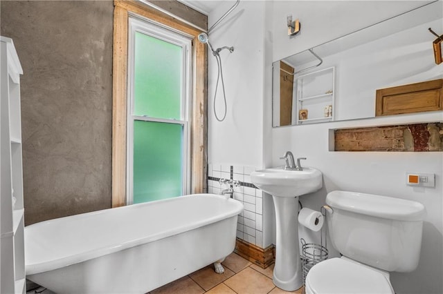 1637 Jefferson St, Kansas City, MO 64108 - full bathroom featuring a freestanding bath and tile patterned flooring