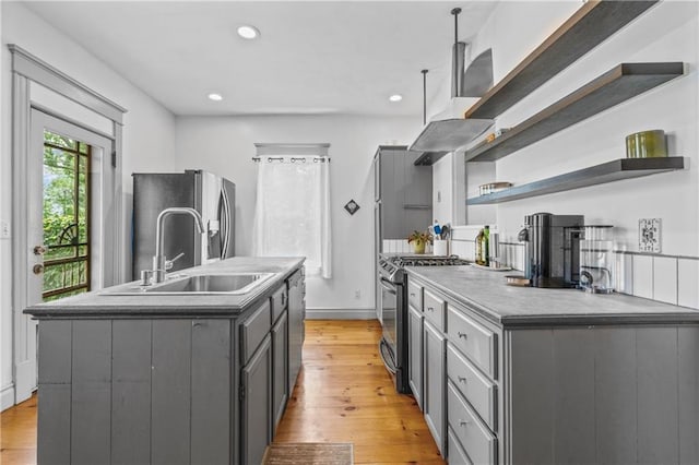 1637 Jefferson St, Kansas City, MO 64108 - kitchen featuring open shelves, appliances with stainless steel finishes, gray cabinetry, light wood-style floors, and recessed lighting