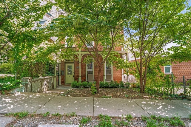 1637 Jefferson St, Kansas City, MO 64108 - obstructed view of property featuring brick siding