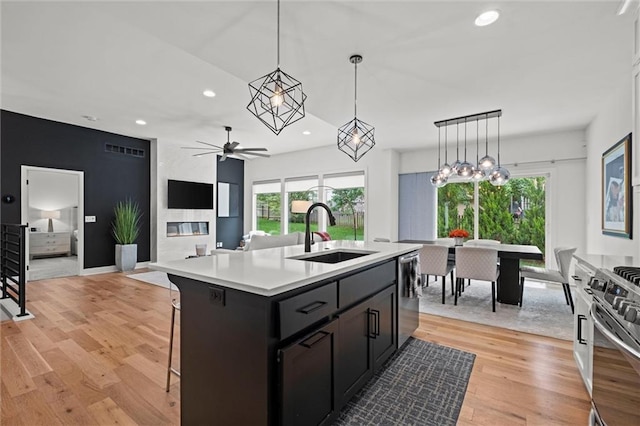 1213 NE Goshen Dr, Lees Summit, MO 64064 - kitchen with appliances with stainless steel finishes, light countertops, recessed lighting, a ceiling fan, and light wood-style floors