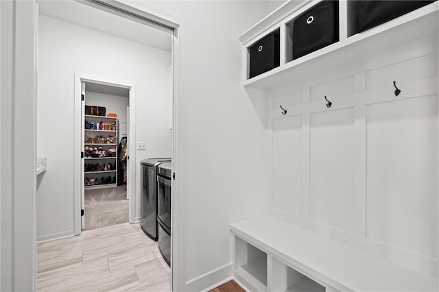 1213 NE Goshen Dr, Lees Summit, MO 64064 - mudroom with washing machine and dryer and light wood-style floors