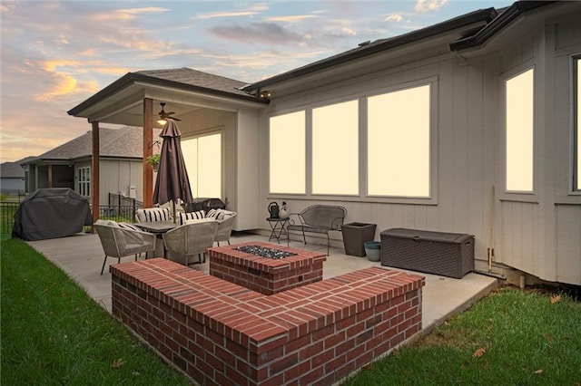 1213 NE Goshen Dr, Lees Summit, MO 64064 - patio terrace at dusk with a grill, a fire pit, a patio area, and a ceiling fan