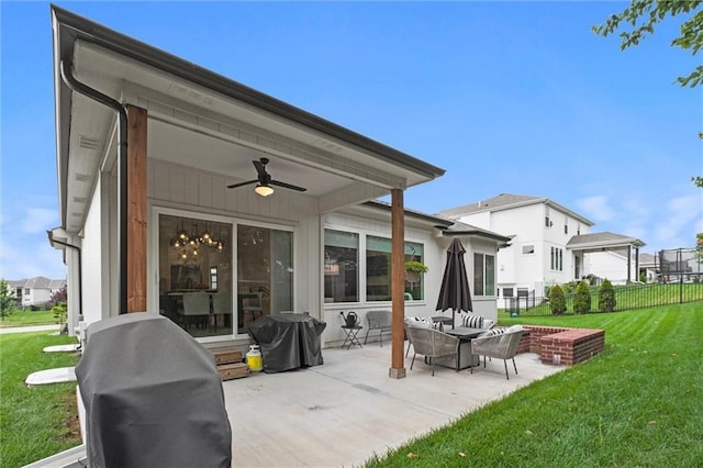1213 NE Goshen Dr, Lees Summit, MO 64064 - view of patio / terrace with area for grilling, a ceiling fan, and a residential view