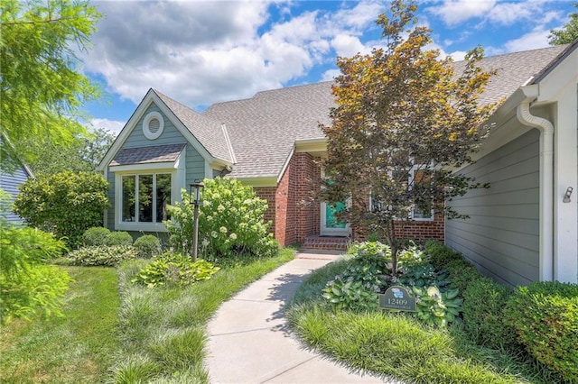 12409 Cambridge Cir, Leawood, KS 66209 - view of front of property with roof with shingles and brick siding