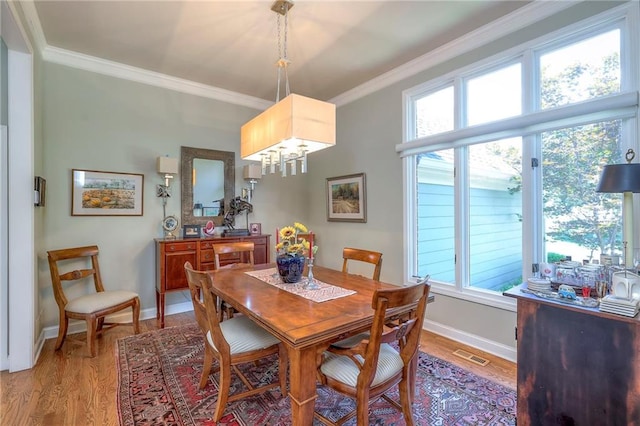 12409 Cambridge Cir, Leawood, KS 66209 - dining room with ornamental molding and light wood finished floors
