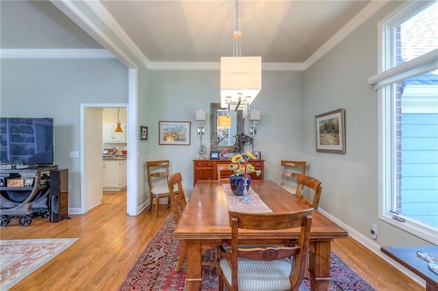 12409 Cambridge Cir, Leawood, KS 66209 - dining room with light wood-type flooring and ornamental molding