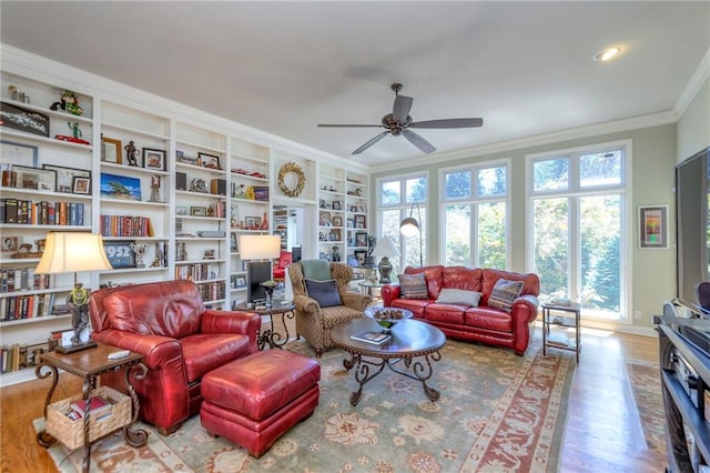 12409 Cambridge Cir, Leawood, KS 66209 - living room featuring crown molding, ceiling fan, wood finished floors, plenty of natural light, and built in features