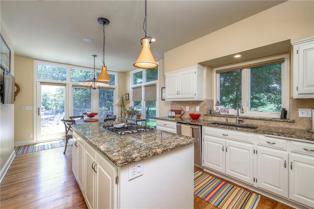 12409 Cambridge Cir, Leawood, KS 66209 - kitchen with appliances with stainless steel finishes, stone counters, and decorative backsplash