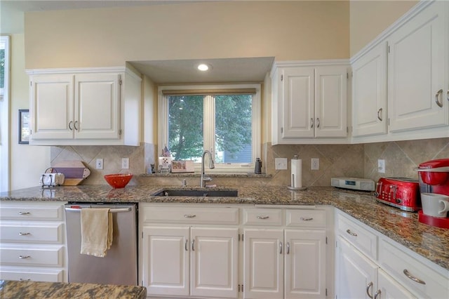 12409 Cambridge Cir, Leawood, KS 66209 - kitchen with dishwasher, white cabinets, tasteful backsplash, and stone countertops