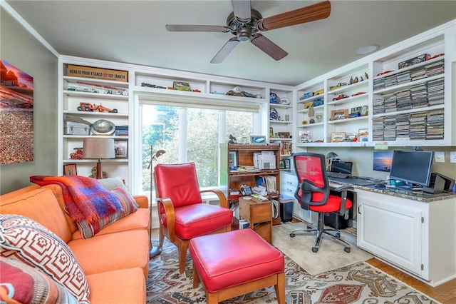12409 Cambridge Cir, Leawood, KS 66209 - office with a ceiling fan, built in desk, and light wood finished floors