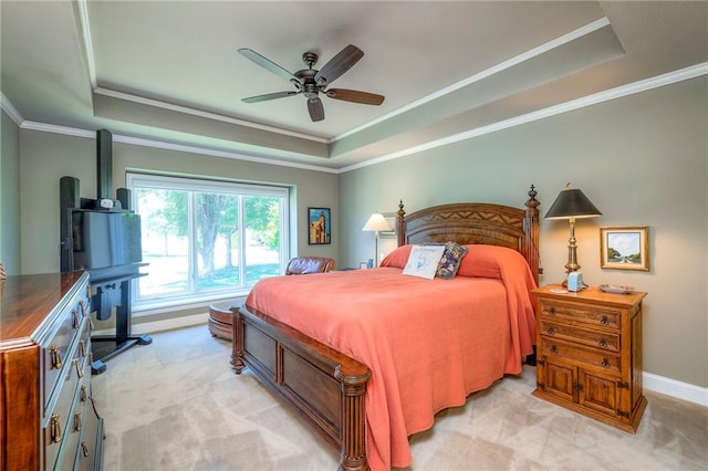 12409 Cambridge Cir, Leawood, KS 66209 - bedroom featuring a raised ceiling, light carpet, crown molding, and ceiling fan