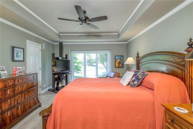 12409 Cambridge Cir, Leawood, KS 66209 - bedroom with a raised ceiling, light colored carpet, crown molding, and a ceiling fan