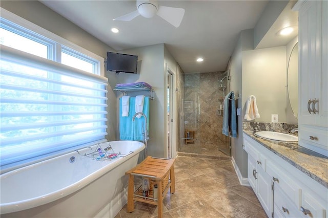 12409 Cambridge Cir, Leawood, KS 66209 - full bath featuring a stall shower, vanity, a freestanding tub, a ceiling fan, and recessed lighting