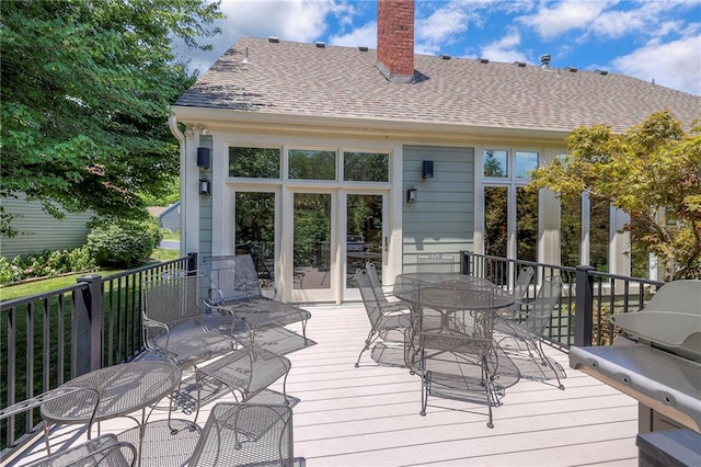 12409 Cambridge Cir, Leawood, KS 66209 - wooden terrace with outdoor dining space
