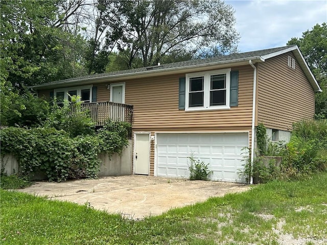 34908 E Shores Rd, Lone Jack, MO 64070 - view of front of home with a garage and driveway