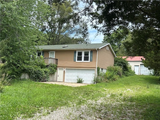 34908 E Shores Rd, Lone Jack, MO 64070 - view of front facade with a garage and a front yard