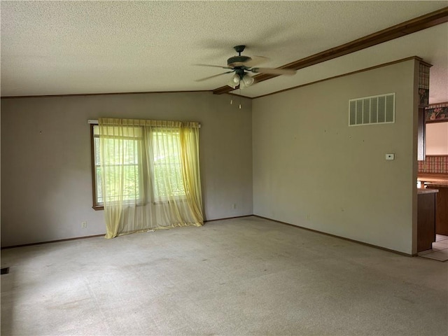 34908 E Shores Rd, Lone Jack, MO 64070 - spare room featuring ceiling fan, light carpet, lofted ceiling, a textured ceiling, and crown molding