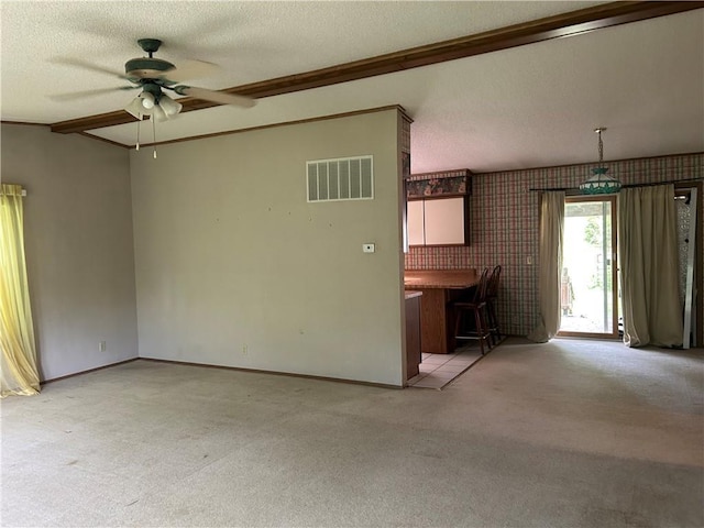 34908 E Shores Rd, Lone Jack, MO 64070 - unfurnished living room with light colored carpet, ceiling fan, wallpapered walls, a textured ceiling, and ornamental molding