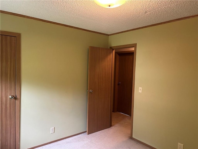 34908 E Shores Rd, Lone Jack, MO 64070 - spare room featuring light carpet, ornamental molding, and a textured ceiling