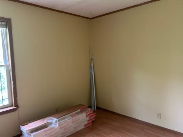 34908 E Shores Rd, Lone Jack, MO 64070 - empty room with wood finished floors and ornamental molding