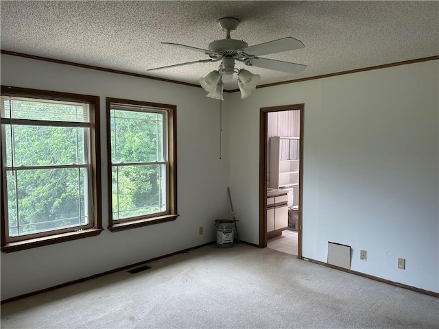 34908 E Shores Rd, Lone Jack, MO 64070 - spare room with light colored carpet, ceiling fan, a textured ceiling, and ornamental molding