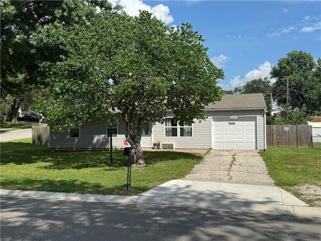 609 N 83rd Ter, Kansas City, KS 66112 - view of front of house with a garage and asphalt driveway