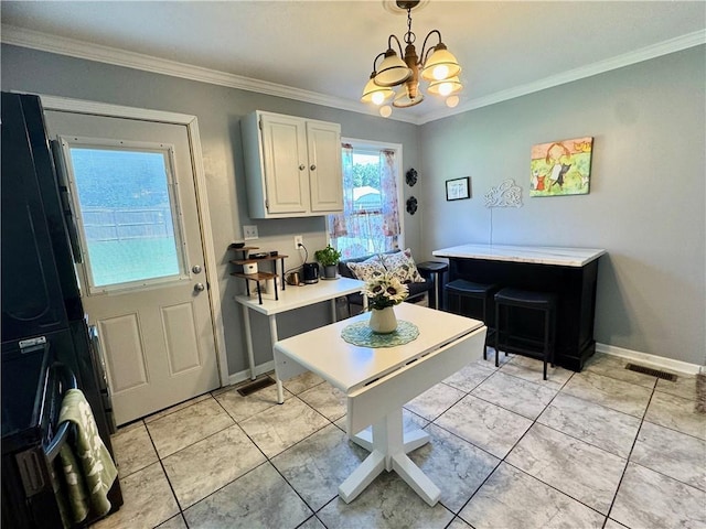 609 N 83rd Ter, Kansas City, KS 66112 - kitchen featuring ornamental molding, a chandelier, light countertops, and pendant lighting