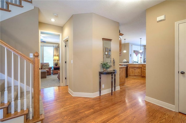 1105 Blazing Star Dr, Lees Summit, MO 64081 - corridor featuring light wood-type flooring and stairs