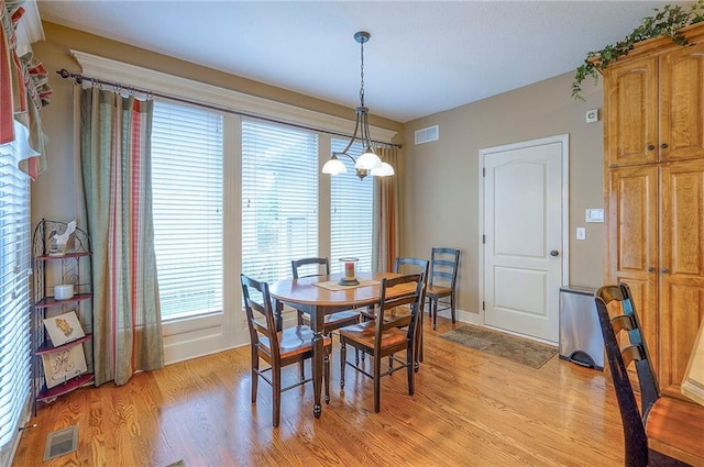 1105 Blazing Star Dr, Lees Summit, MO 64081 - dining room with a chandelier and light wood finished floors