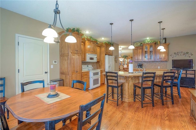 1105 Blazing Star Dr, Lees Summit, MO 64081 - dining room with light wood finished floors and recessed lighting