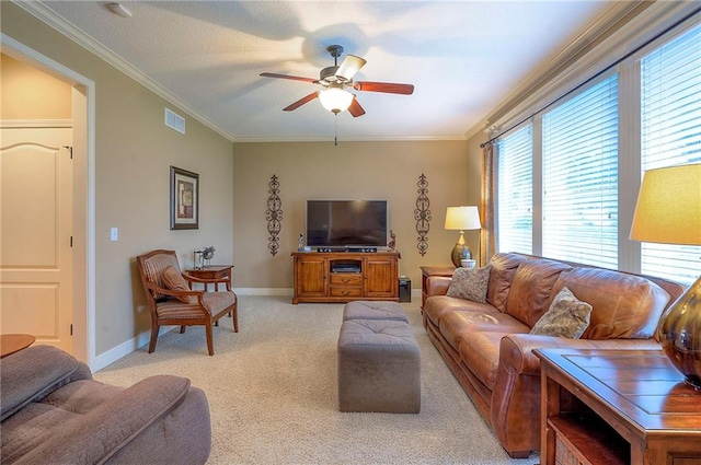 1105 Blazing Star Dr, Lees Summit, MO 64081 - living area with healthy amount of natural light, ornamental molding, ceiling fan, and light colored carpet