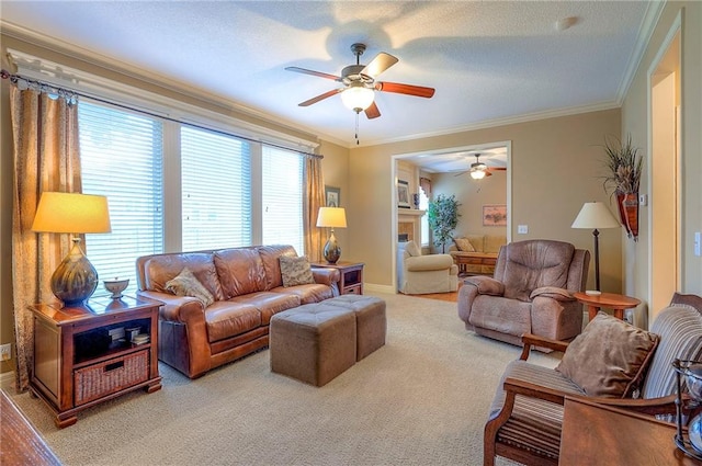 1105 Blazing Star Dr, Lees Summit, MO 64081 - carpeted living room featuring a ceiling fan, ornamental molding, and a fireplace