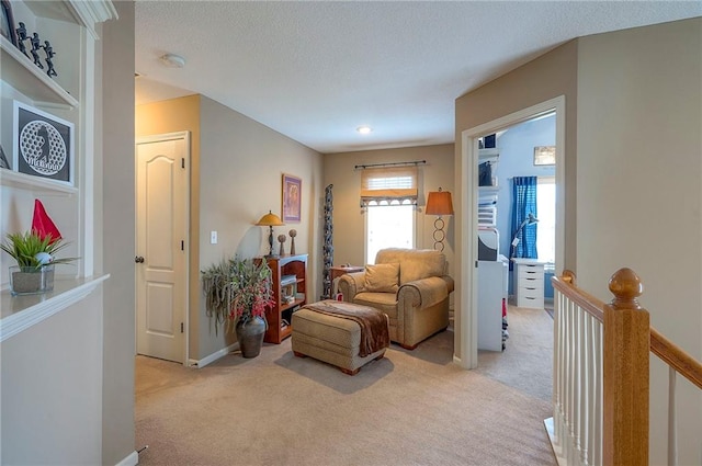1105 Blazing Star Dr, Lees Summit, MO 64081 - sitting room with light carpet and an upstairs landing